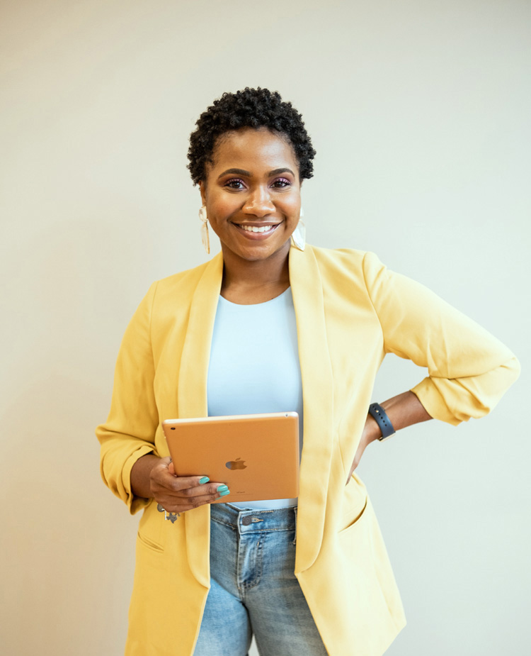 Image of a woman holding a tablet